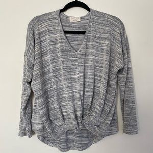 Grey and white long sleeve shirt.